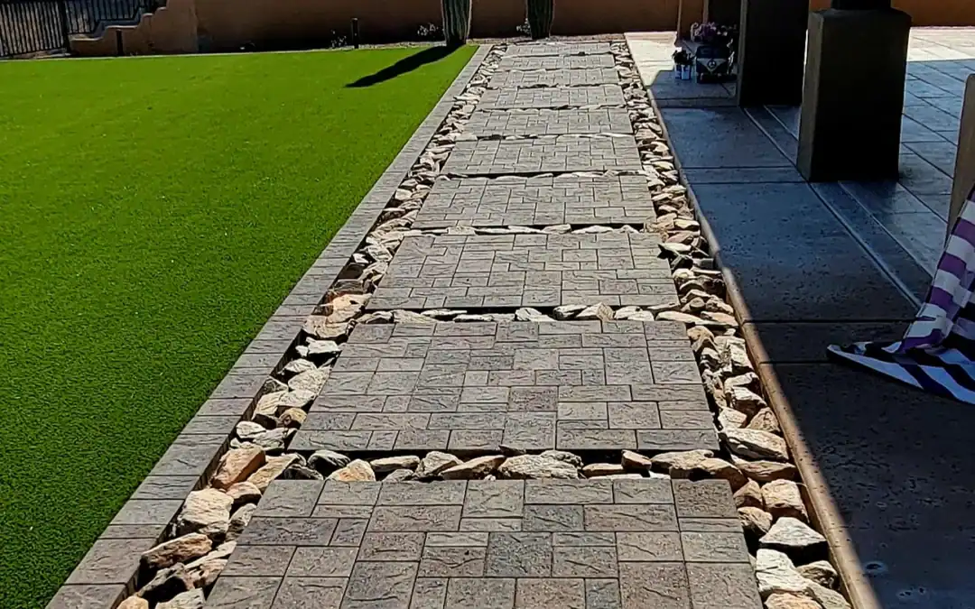 “Scottsdale modern landscape with concrete pavers laid in a precise square pattern, creating a clean contemporary look installed by Eclipse Landscape & Design.”