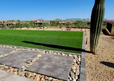 “Backyard with artificial turf and Sonoran Desert landscaping installed by Eclipse Landscape & Design.”